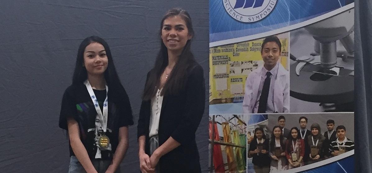 Ava Lagasse accepts her awards at the Manitoba School Science Symposium.
