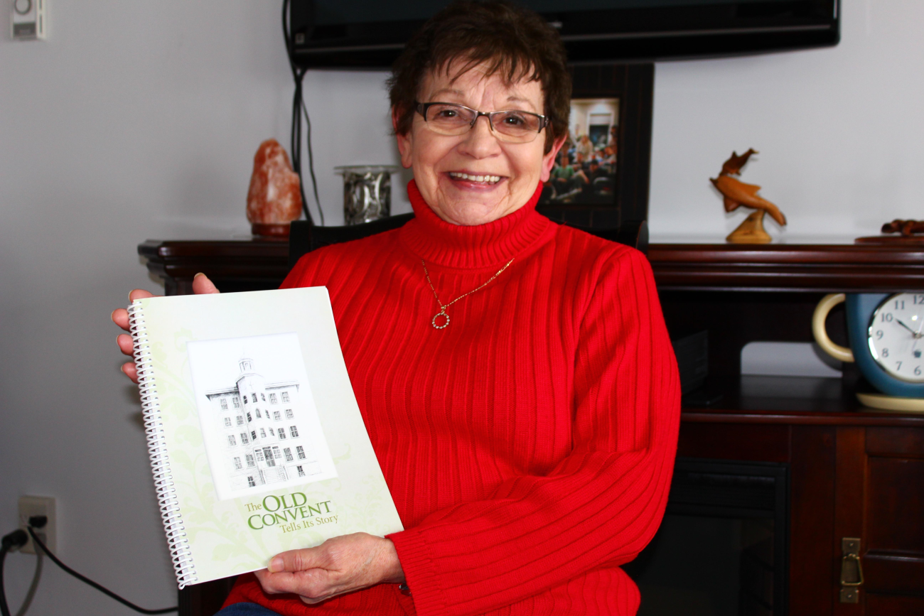 Rhea Trudeau with her book, The Old Convent Tells Its Story.