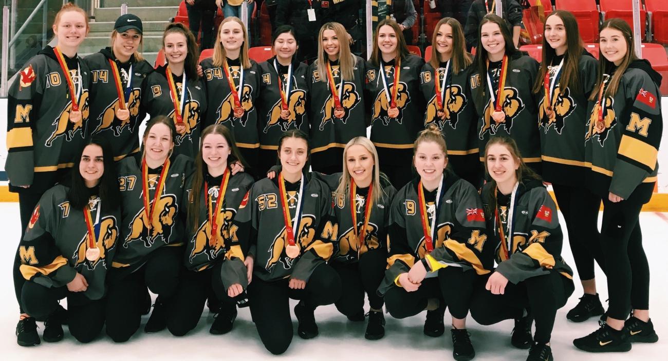 Team Manitoba with their bronze medals.