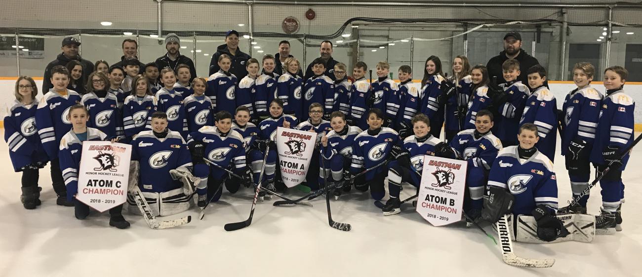 All three Atom Clippers teams, with their championship banners.