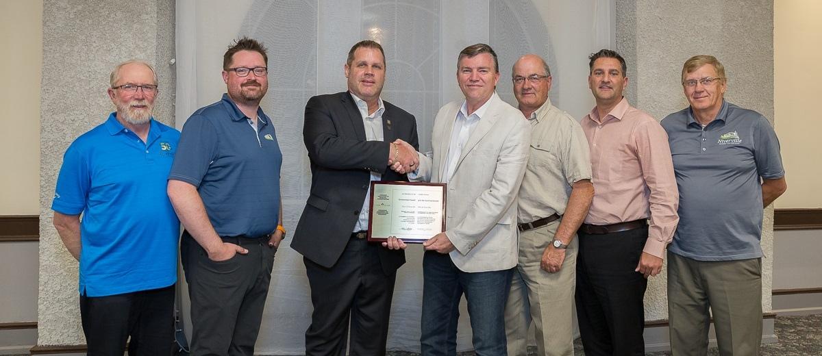 Councillor Chris Wiebe, CAO Eric King, CAMA board member Rodney Sage, Mayor Myron Dyck, and councillors Kevin Stott, Nathan Dueck, and John Funk.
