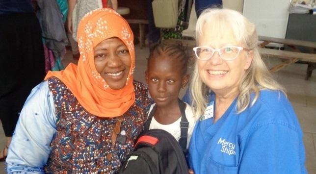 Laura Klassen with a patient and her mother while on a medical mission in Africa.