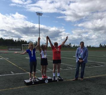 Sandra Klassen, on the far left, receiving a silver medal in track.