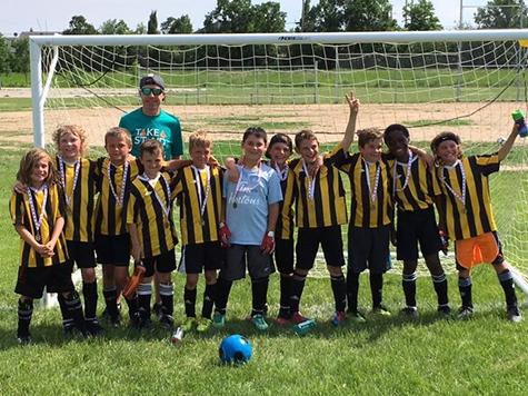 Coach Todd Neil, (l-r) Kerrick Neil, Max Dowse, Tom Bray, Raine Doiron, Dallin Hornung, Zachary Normand, Kaleb Collette, Micah Penner, Levi Brandt, Michael Olatundun, Ethan Bowyer