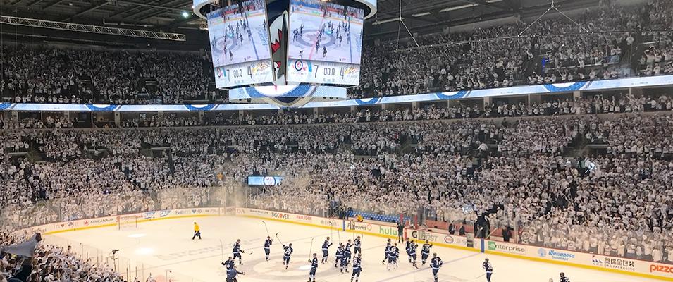 The hometown crowd, in full whiteout mode, celebrates a playoff victory over the Minnesota Wild