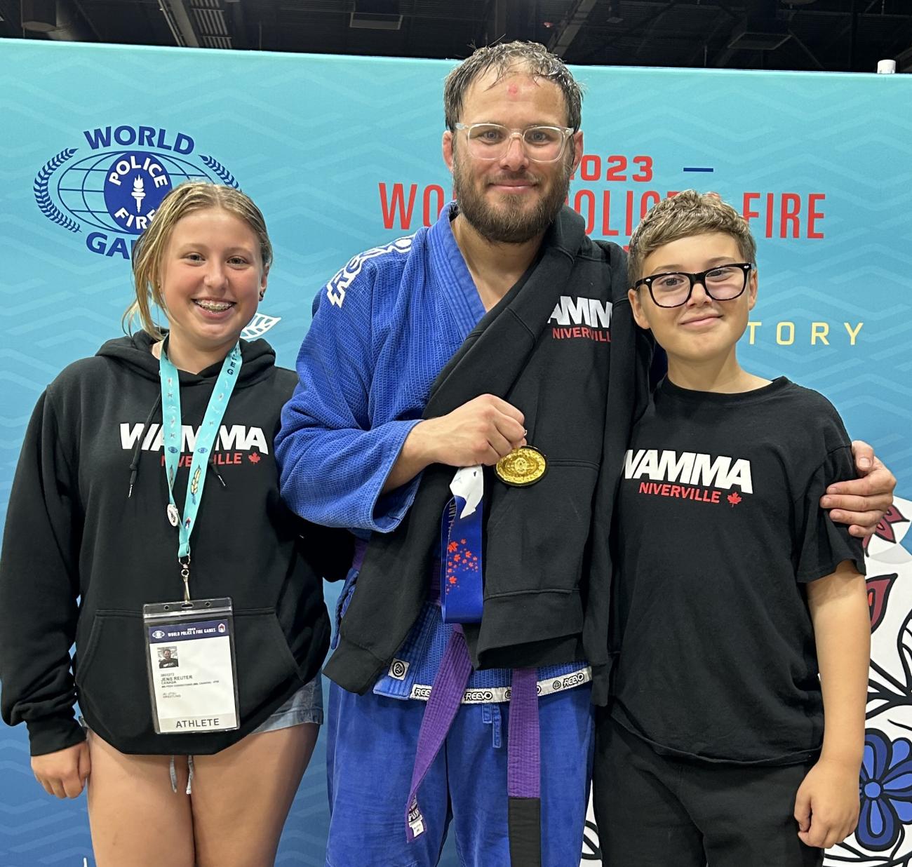 Jens Reuter with his kids at the World Police and Fire Games in 2023, where he won gold in his division in jiujitsu.