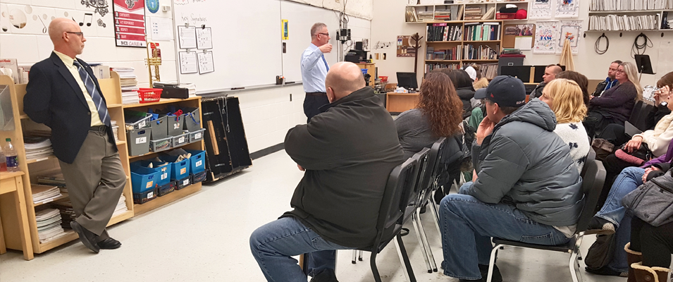 Parents gather to hear Principal Michael Koester and Superintendent Randy Dueck address their concerns.