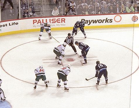 Mark Scheifele takes a face-off at the BellMTS Place.