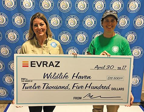 Tara Stokotelny and Joy Kennedy receive a donation cheque