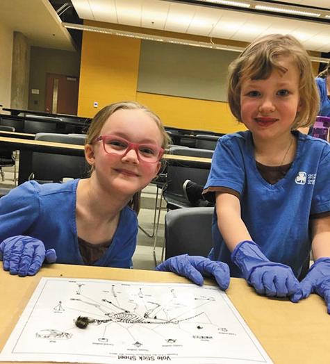 Brownies Erin Beaton and Ryleigh Wachniak attend STEM Day at the University of Manitoba