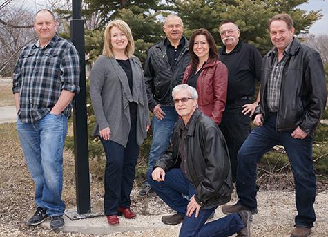 Todd Anderson, Shauna Harms-Wiebe, Burt Hiebert, Coralee Warkentin, Vic Froese, Gerry Guenther, Dan Klippenstein (kneeling