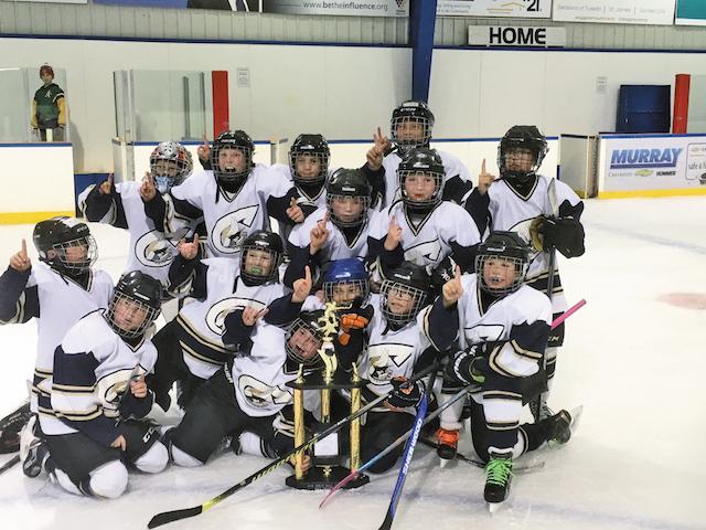 The Atom A Clippers celebrate their victory