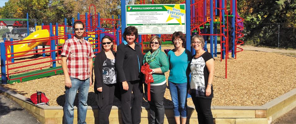 Members of the NES Play Structure Committee at the structure's ribbon-cutting a few years ago