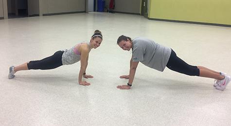 Fitness instructor Mel Smook and Chantel Todd doing a plank