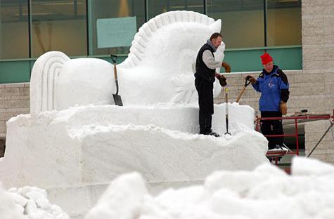 Gary Tessier and Real Berard sculpting the "Toy Trojan Horse" in Ottawa