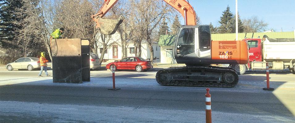 Excavation underway on Main Street to repair a sewer connecting line