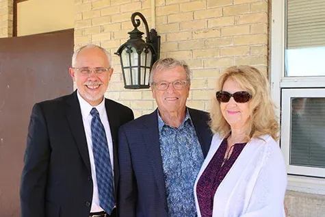 Dr. David Johnson alongside Herb and Erna Buller