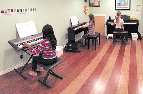 Children take part in Laura Visser's Music for Young Children program