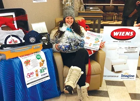 Raffle winner Mel Bergen arrives to claim her prizes