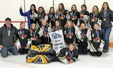 The Red River Rage U12 team celebrates winning gold