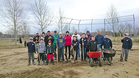 Volunteers clean baseball diamonds in Hespeler Park