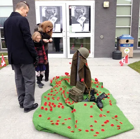 Attendees pay respects following the ceremony