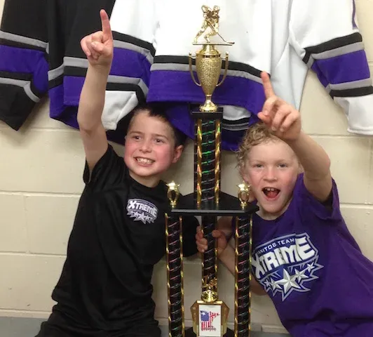 Tristan Cousineau and Max Dowse celebrate with their first place trophy
